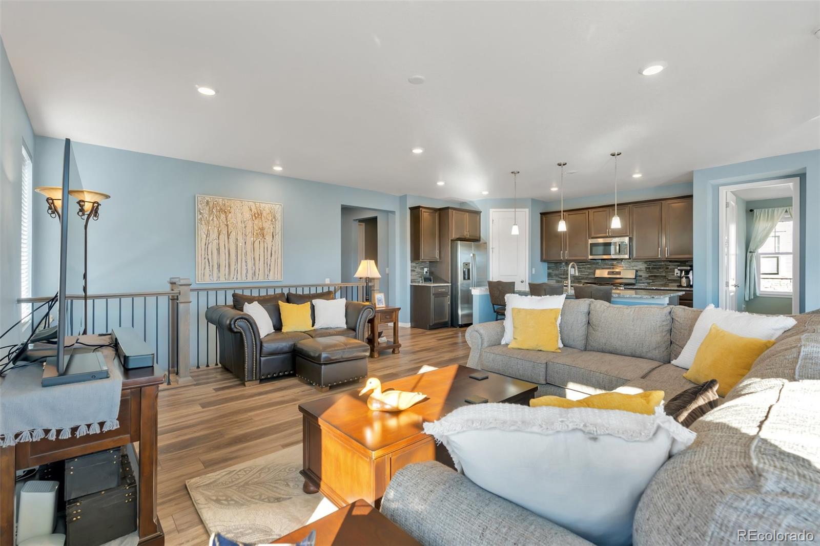 1122 Highpoint Trail Elizabeth, CO 80107 - Photo 12 of 45 a living room with furniture and kitchen view