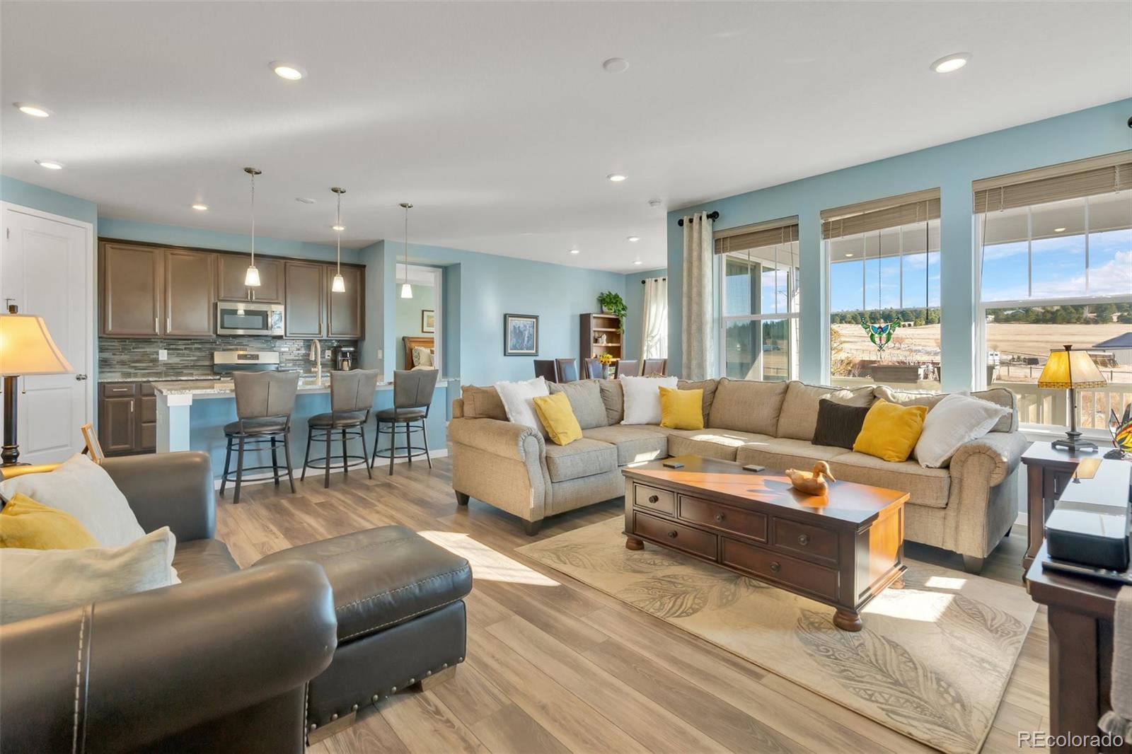 1122 Highpoint Trail Elizabeth, CO 80107 - Photo 13 of 45 a living room with furniture and a large window