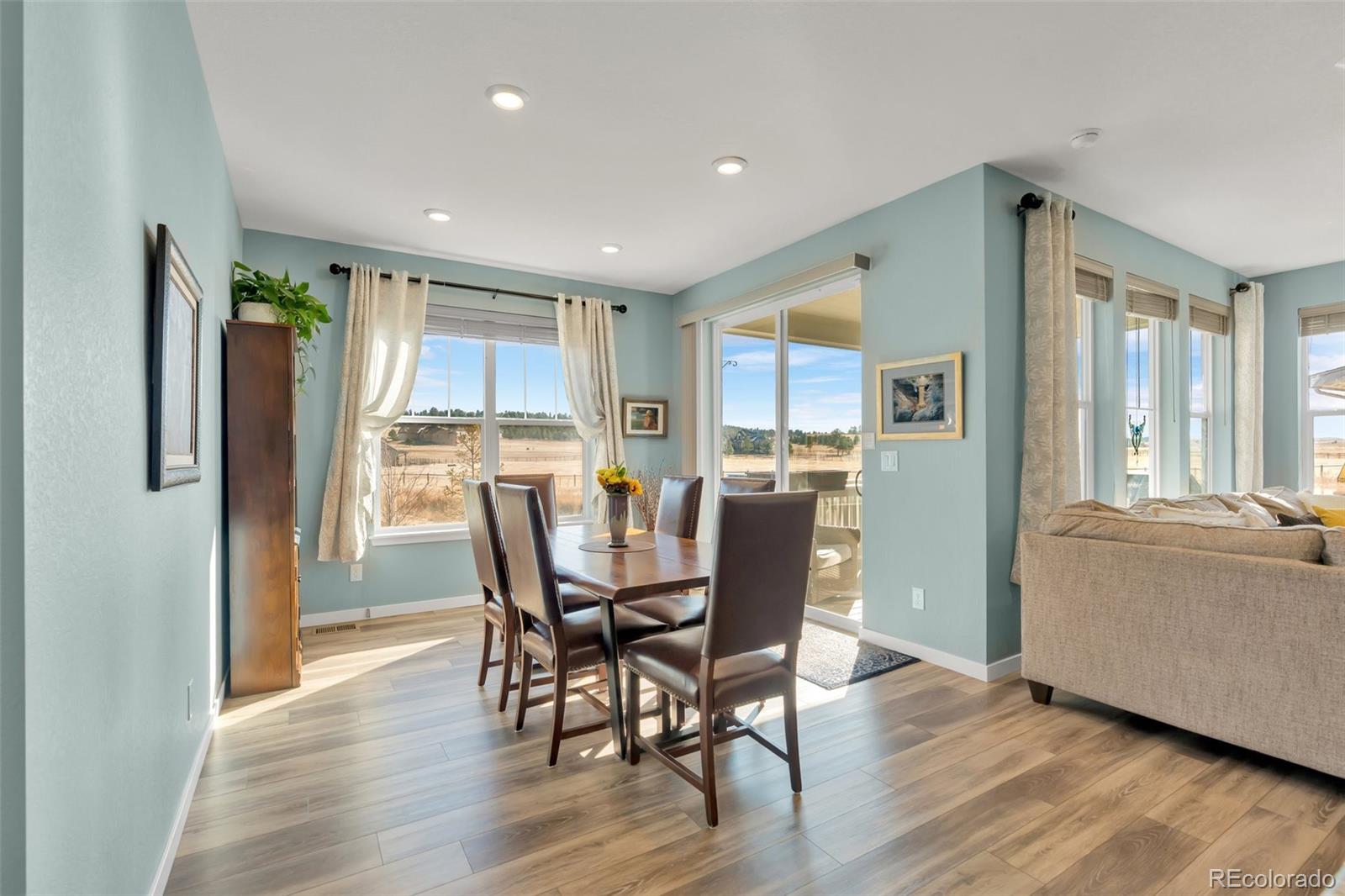 1122 Highpoint Trail Elizabeth, CO 80107 - Photo 19 of 45 a living room with stainless steel appliances granite countertop furniture wooden floor and a kitchen view