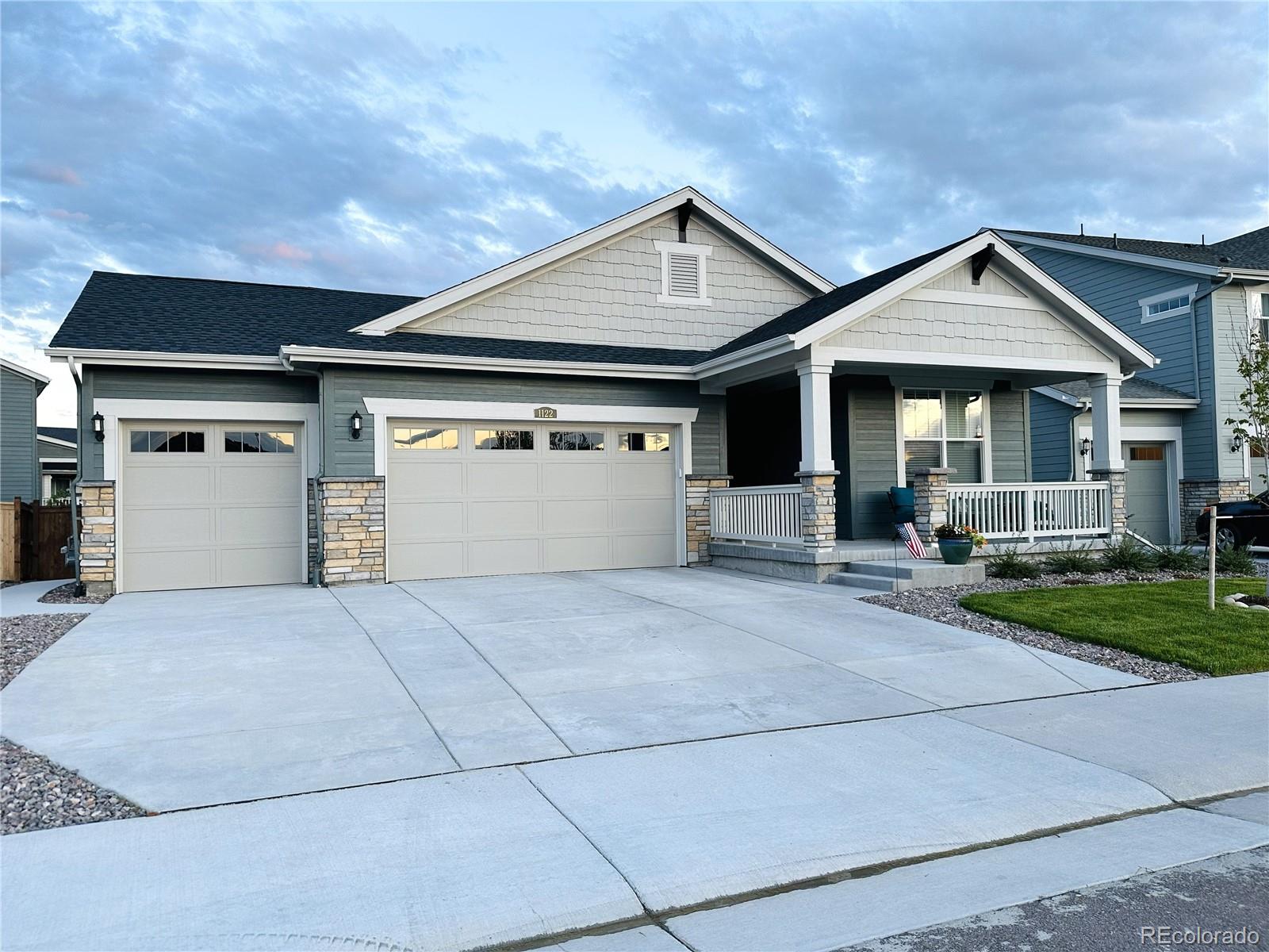 1122 Highpoint Trail Elizabeth, CO 80107 - Photo 2 of 45 a front view of a house with a yard and garage