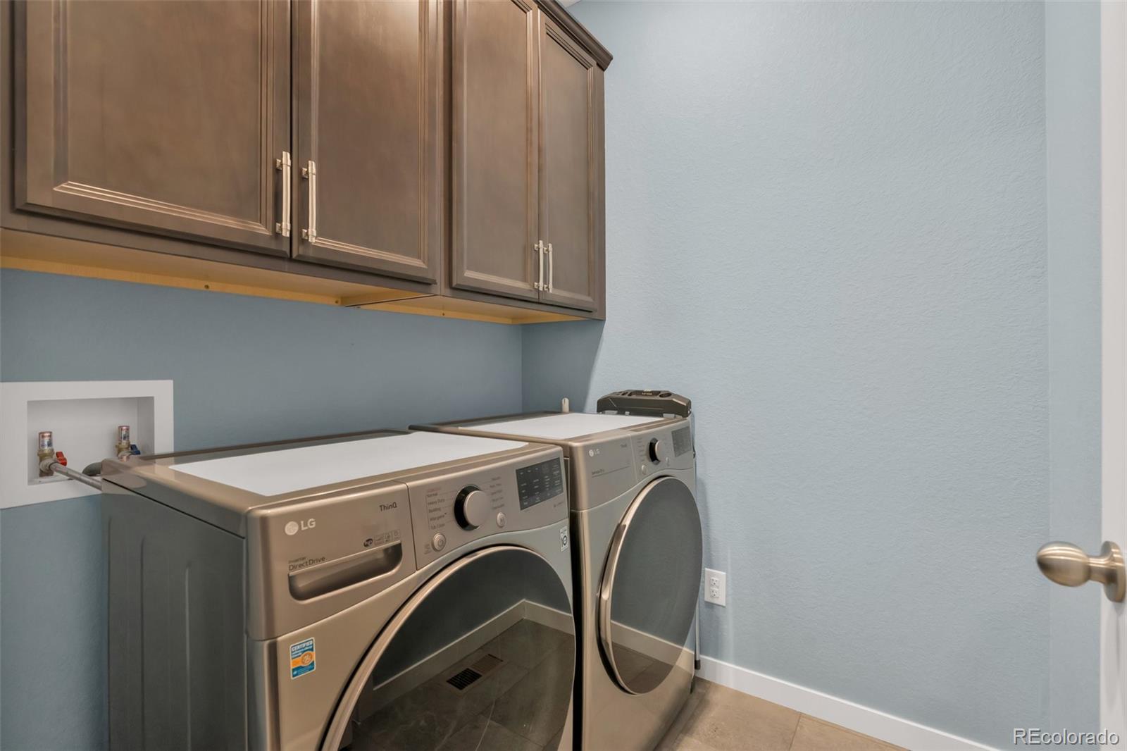 1122 Highpoint Trail Elizabeth, CO 80107 - Photo 22 of 45 a utility room with dryer and washer