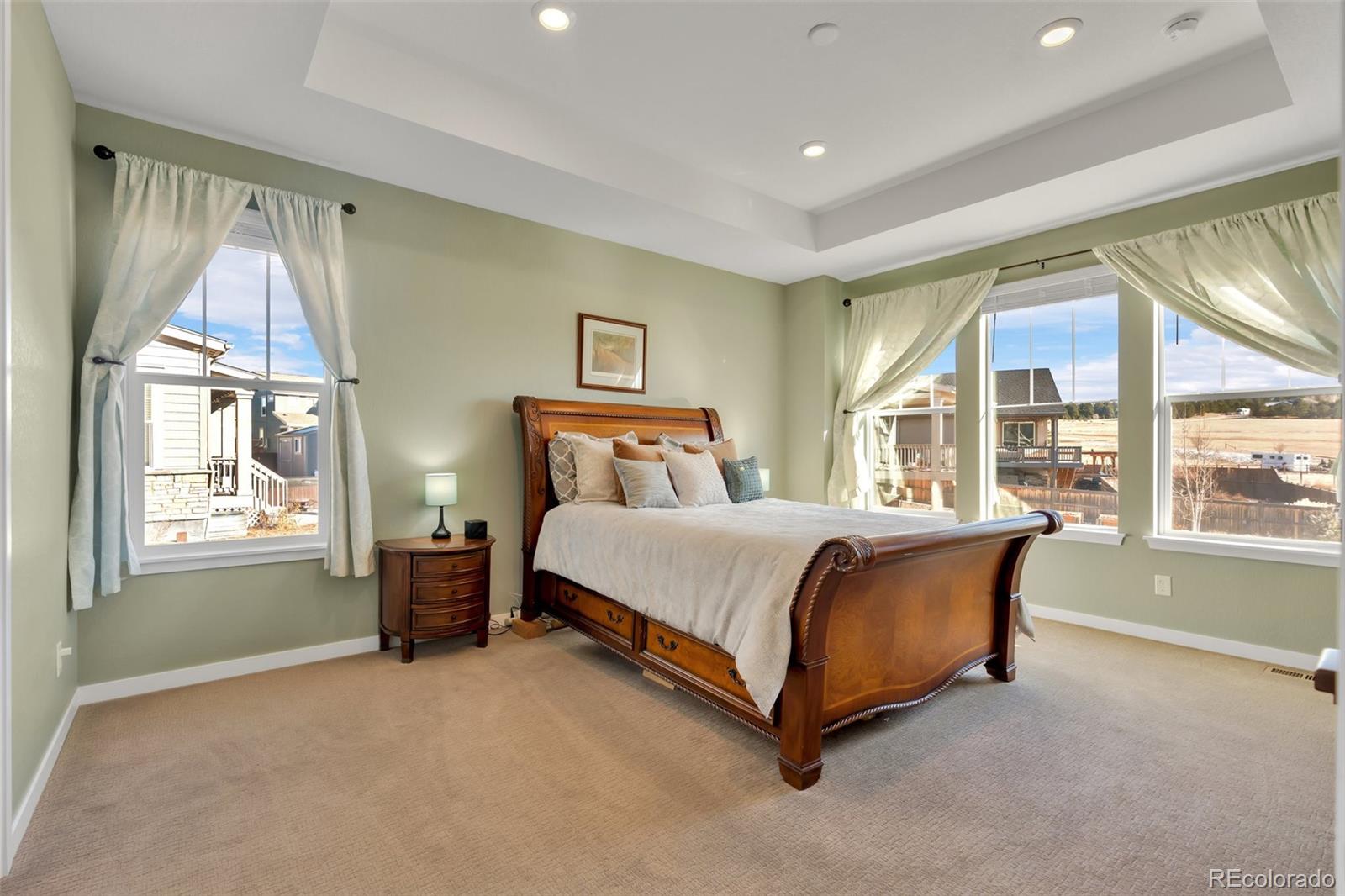 1122 Highpoint Trail Elizabeth, CO 80107 - Photo 24 of 45 a bed sitting in a room next to a window