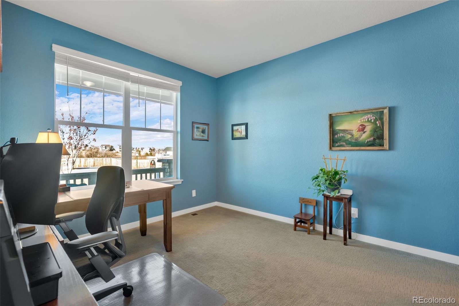 1122 Highpoint Trail Elizabeth, CO 80107 - Photo 32 of 45 a workspace with furniture and a window