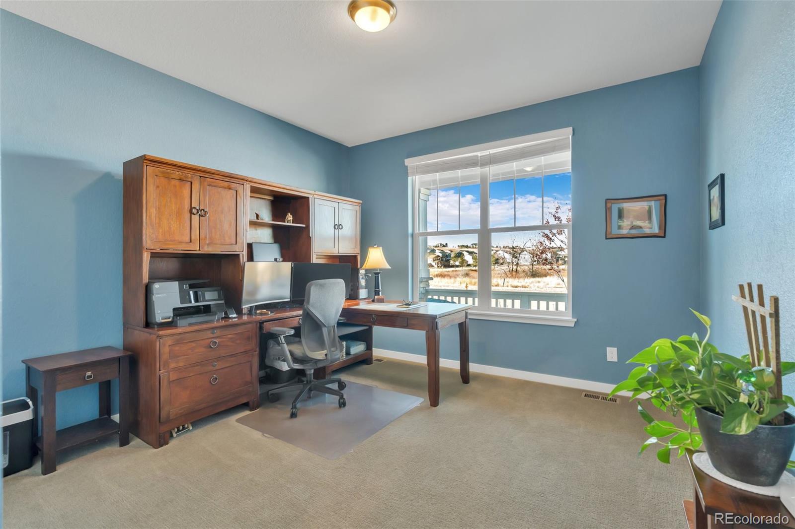 1122 Highpoint Trail Elizabeth, CO 80107 - Photo 33 of 45 a workspace with furniture and a window
