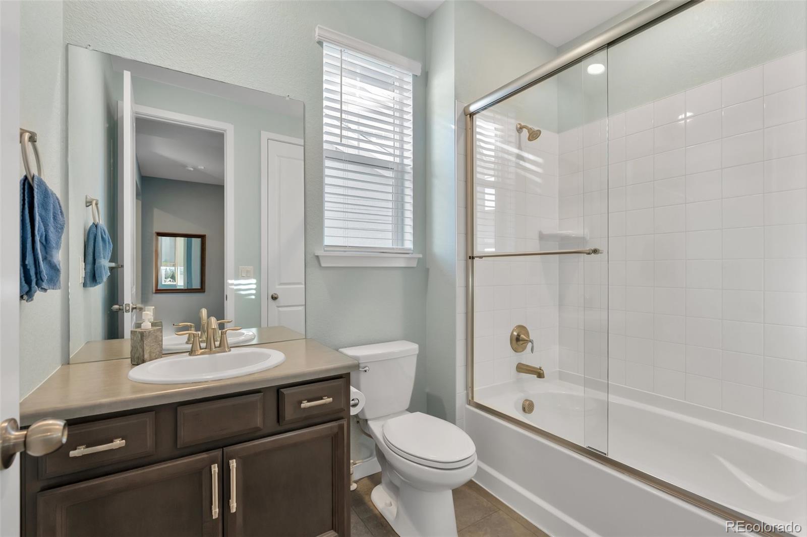 1122 Highpoint Trail Elizabeth, CO 80107 - Photo 36 of 45 a bathroom with a sink toilet and shower