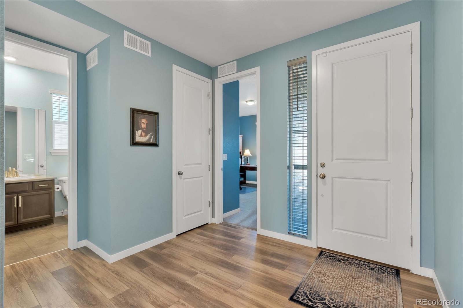 1122 Highpoint Trail Elizabeth, CO 80107 - Photo 9 of 45 a view of livingroom with hardwood floor and cabinet