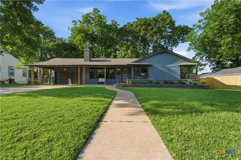 a front view of a house with yard