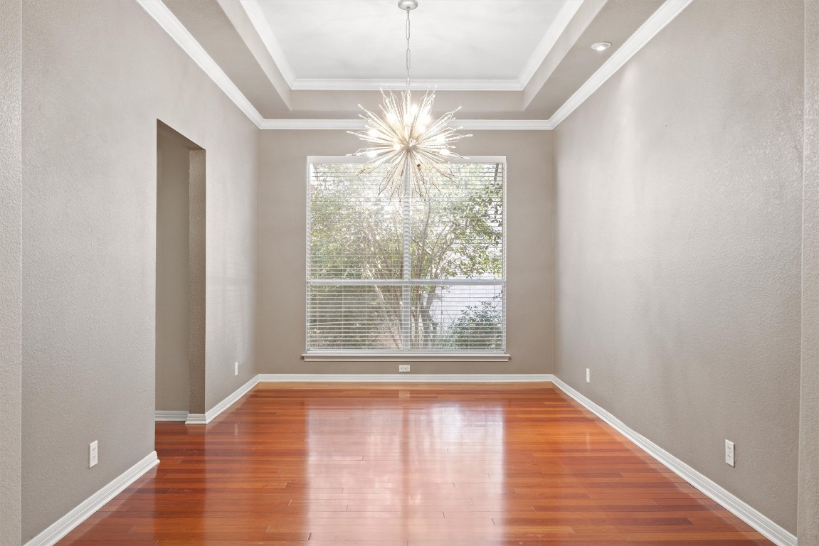 7124 Quimper Lane Austin, TX 78749 - Photo 12 of 40 wooden floor in an empty room with a window