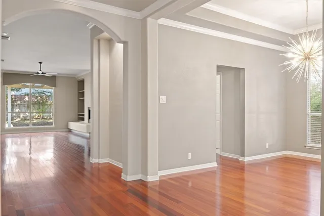 a bathroom with a sink mirror and a bathtub with a mirror