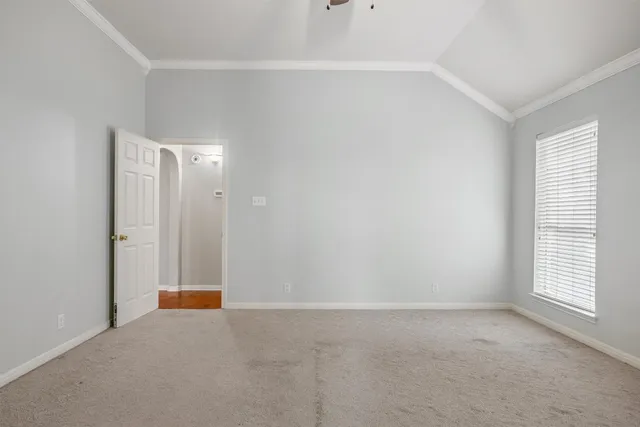 a view of an room with wooden floor and windows