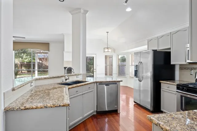 a kitchen with a sink and cabinets