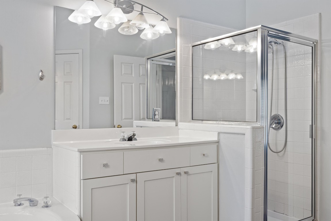 7124 Quimper Lane Austin, TX 78749 - Photo 21 of 40 a bathroom with a sink vanity and a mirror
