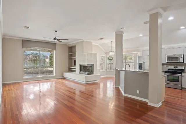 a kitchen with stainless steel appliances granite countertop a refrigerator and a stove top oven
