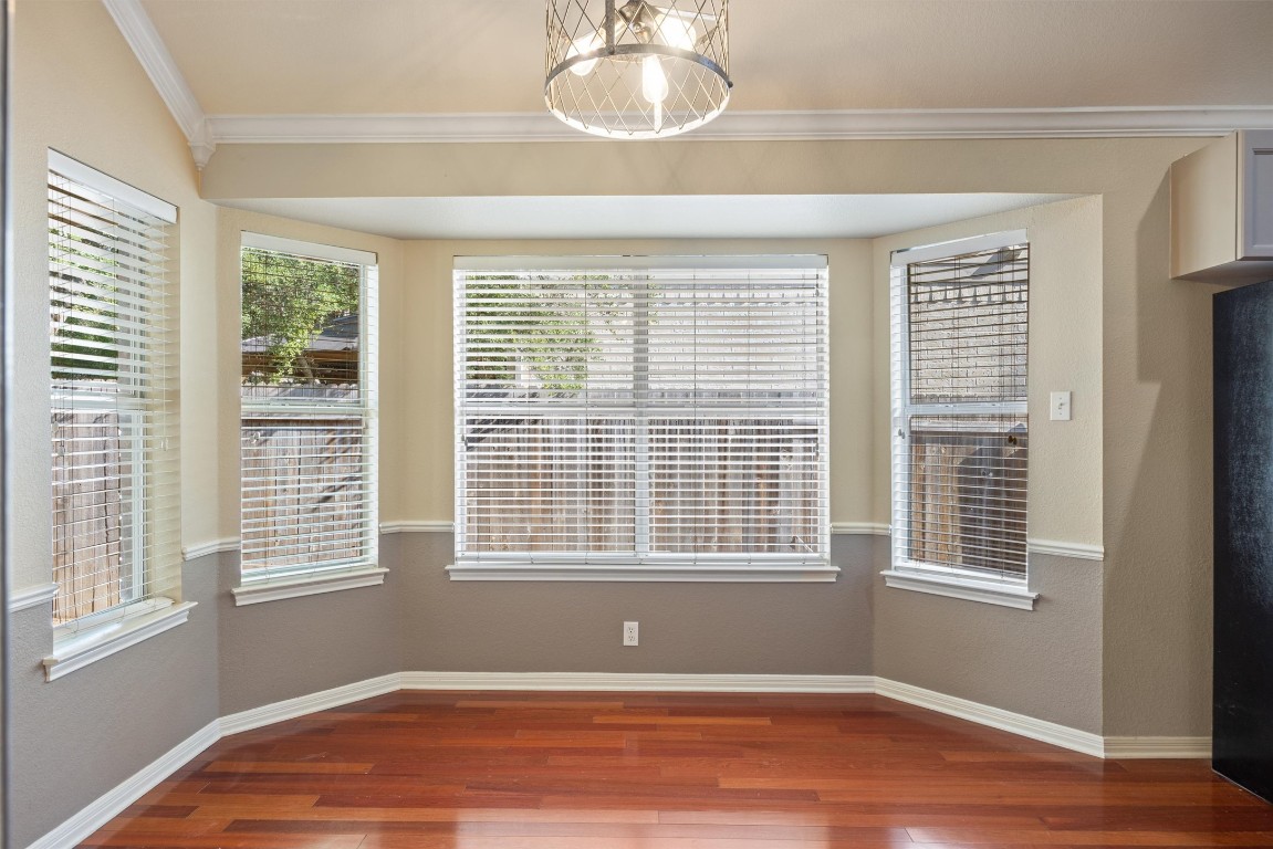 7124 Quimper Lane Austin, TX 78749 - Photo 34 of 40 a view of empty room with wooden floor and fan