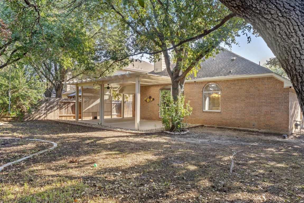 7124 Quimper Lane Austin, TX 78749 - Photo 38 of 40 a front view of a house with a tree