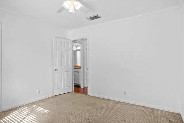 a bathroom with a granite countertop sink a toilet and bathtub