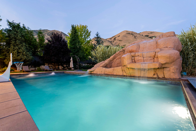 687 South 2080th Street East Springville, UT 84663 - Photo 140 of 149 In-ground swimming pool with a rock formation waterfall feature