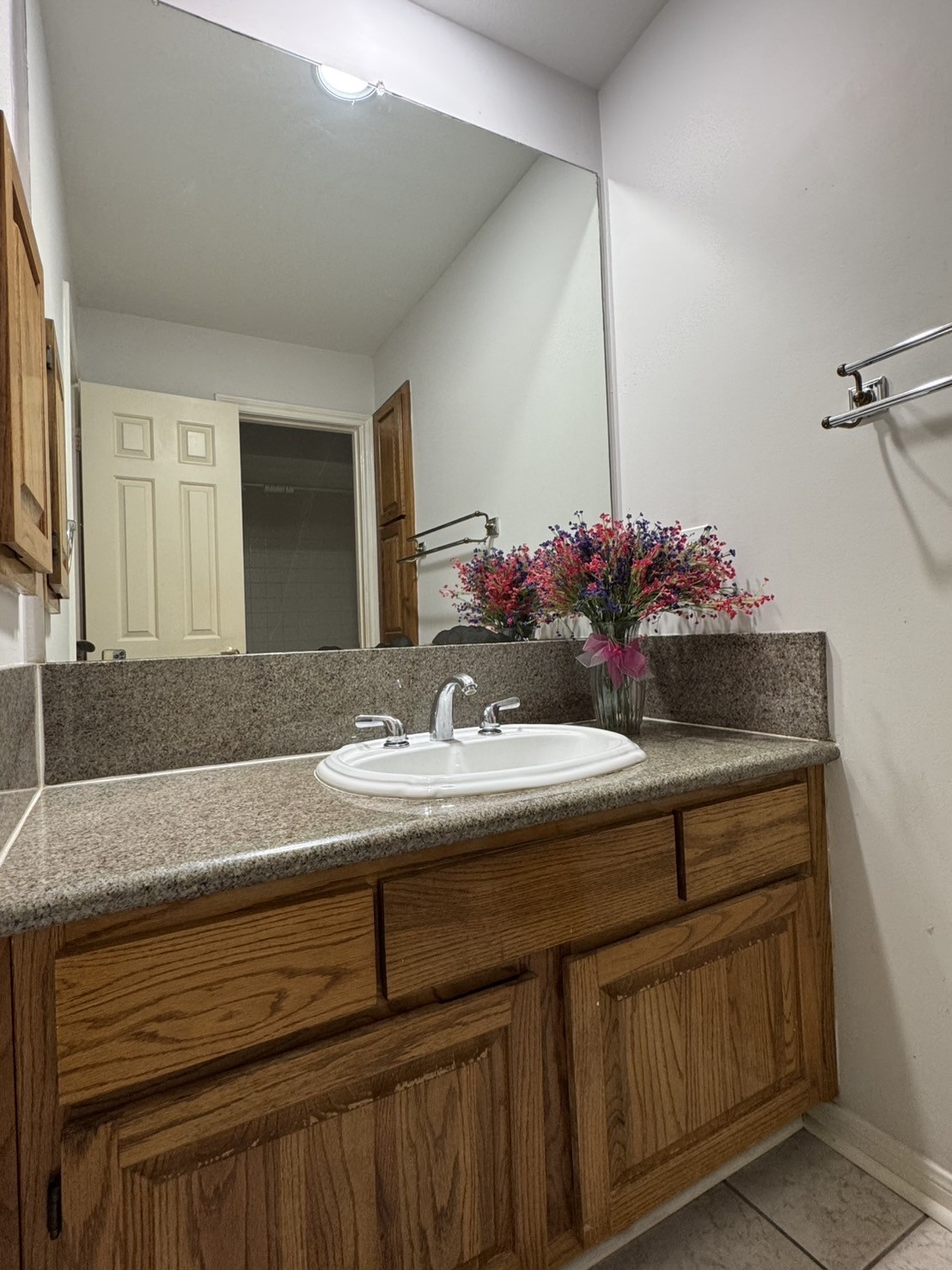 5200 Weslayan Street, Unit 311 Houston, TX 77005 - Photo 18 of 24 a bathroom with a sink and a mirror