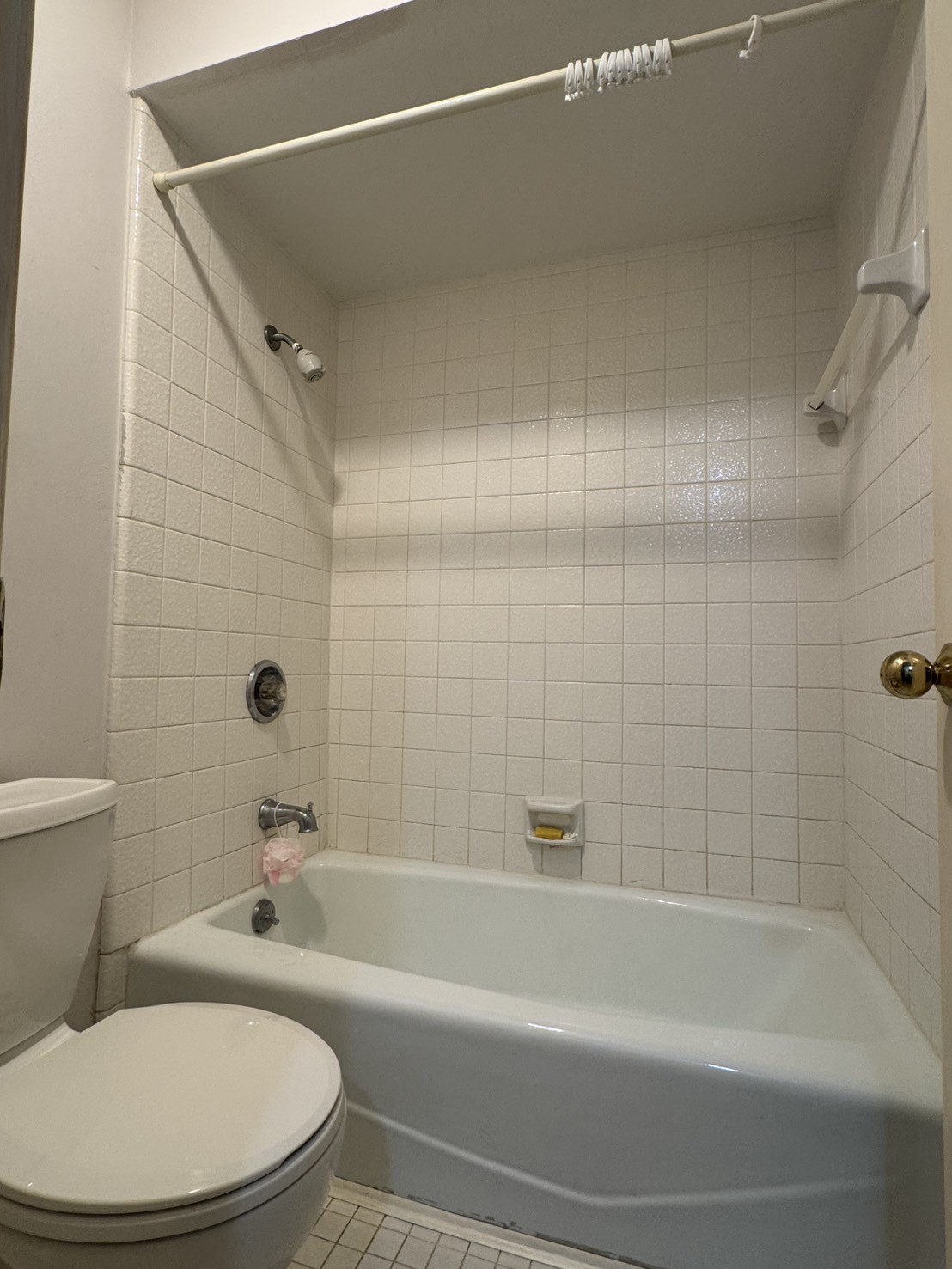 5200 Weslayan Street, Unit 311 Houston, TX 77005 - Photo 19 of 24 a white bath tub sitting next to a white toilet