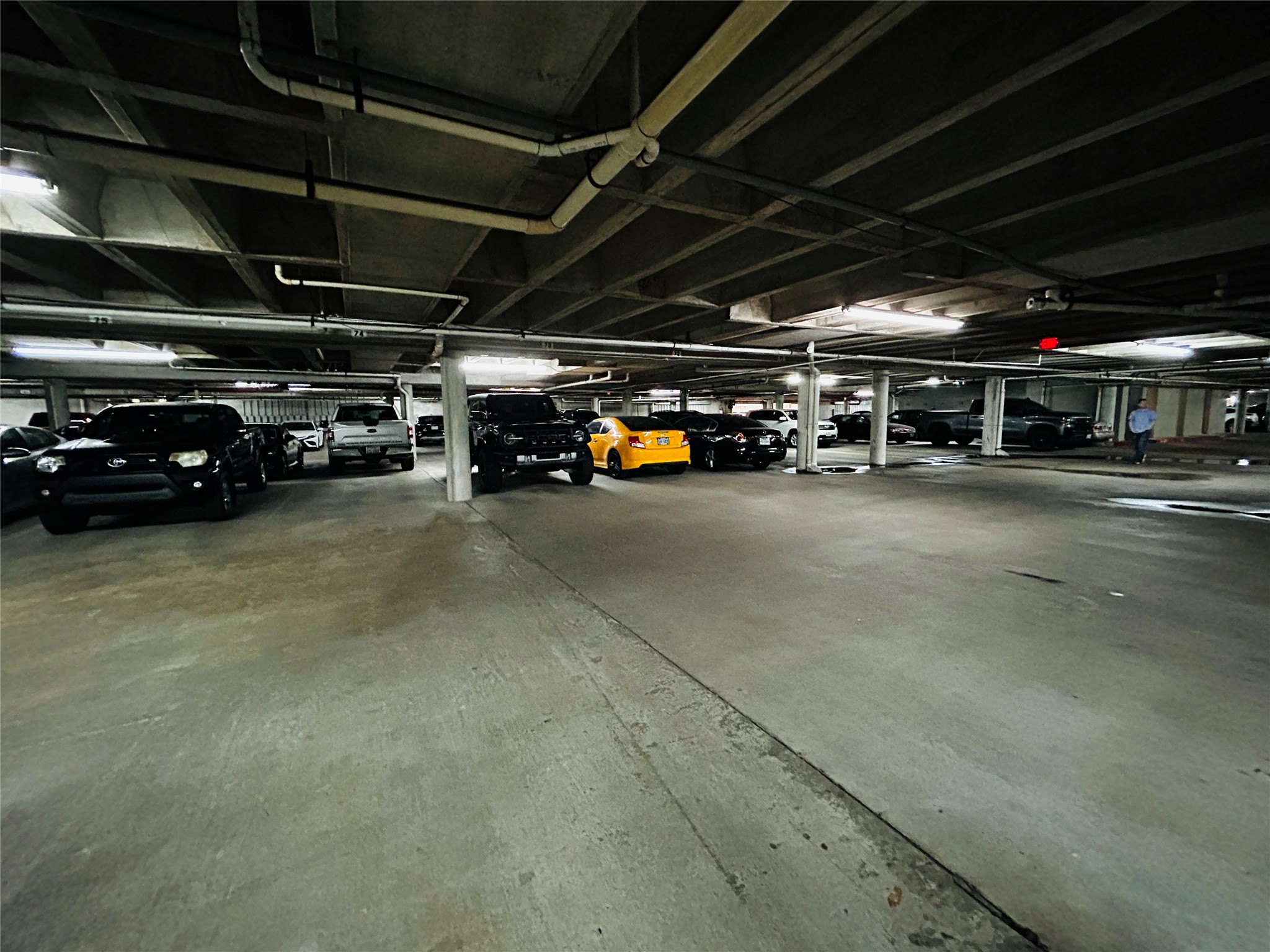 5200 Weslayan Street, Unit 311 Houston, TX 77005 - Photo 24 of 24 a view of parking garage with cars
