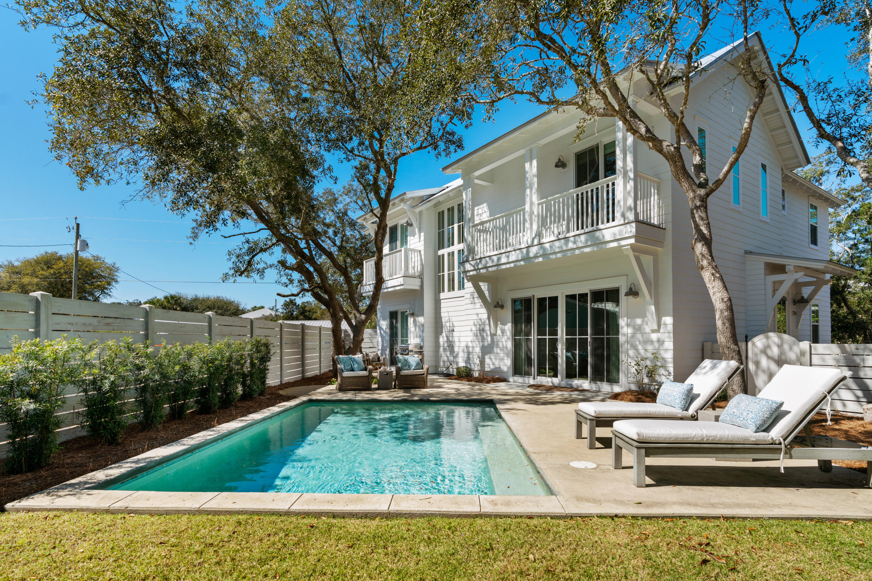 134 Blue Lake Road Santa Rosa Beach, FL 32459 - Photo 1 of 49 a view of a white building with a yard