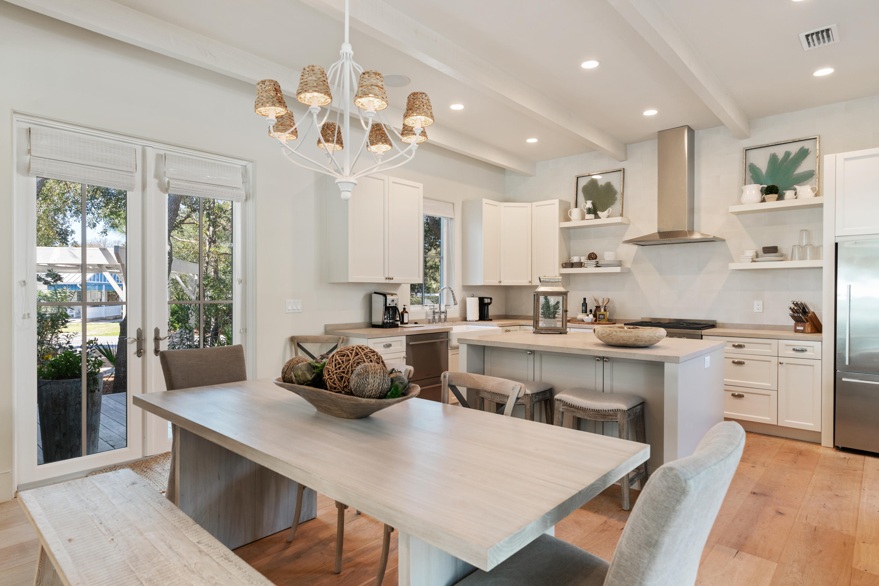 134 Blue Lake Road Santa Rosa Beach, FL 32459 - Photo 12 of 49 a kitchen with a table chairs sink and cabinets
