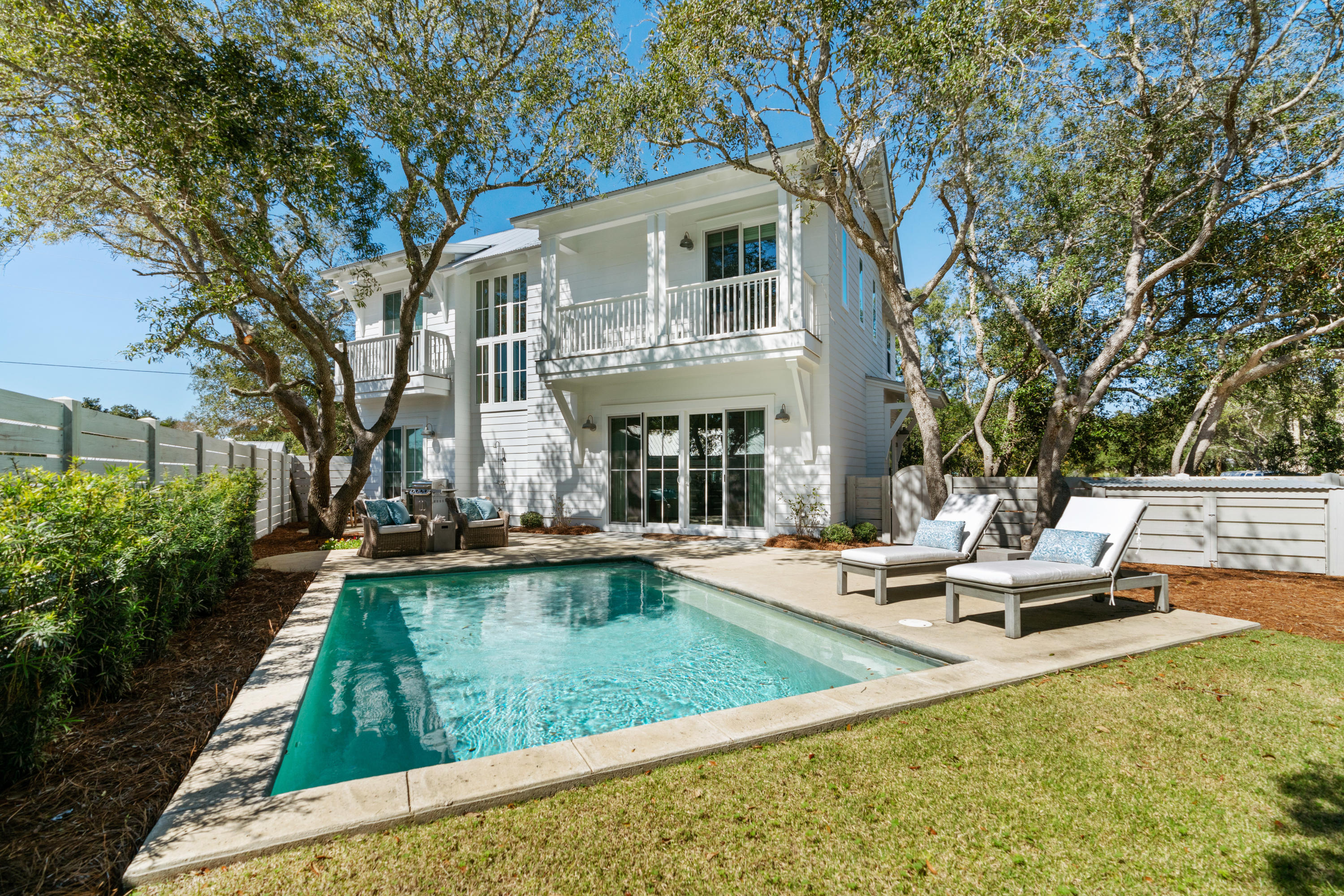 134 Blue Lake Road Santa Rosa Beach, FL 32459 - Photo 20 of 49 a view of a house with swimming pool and sitting area