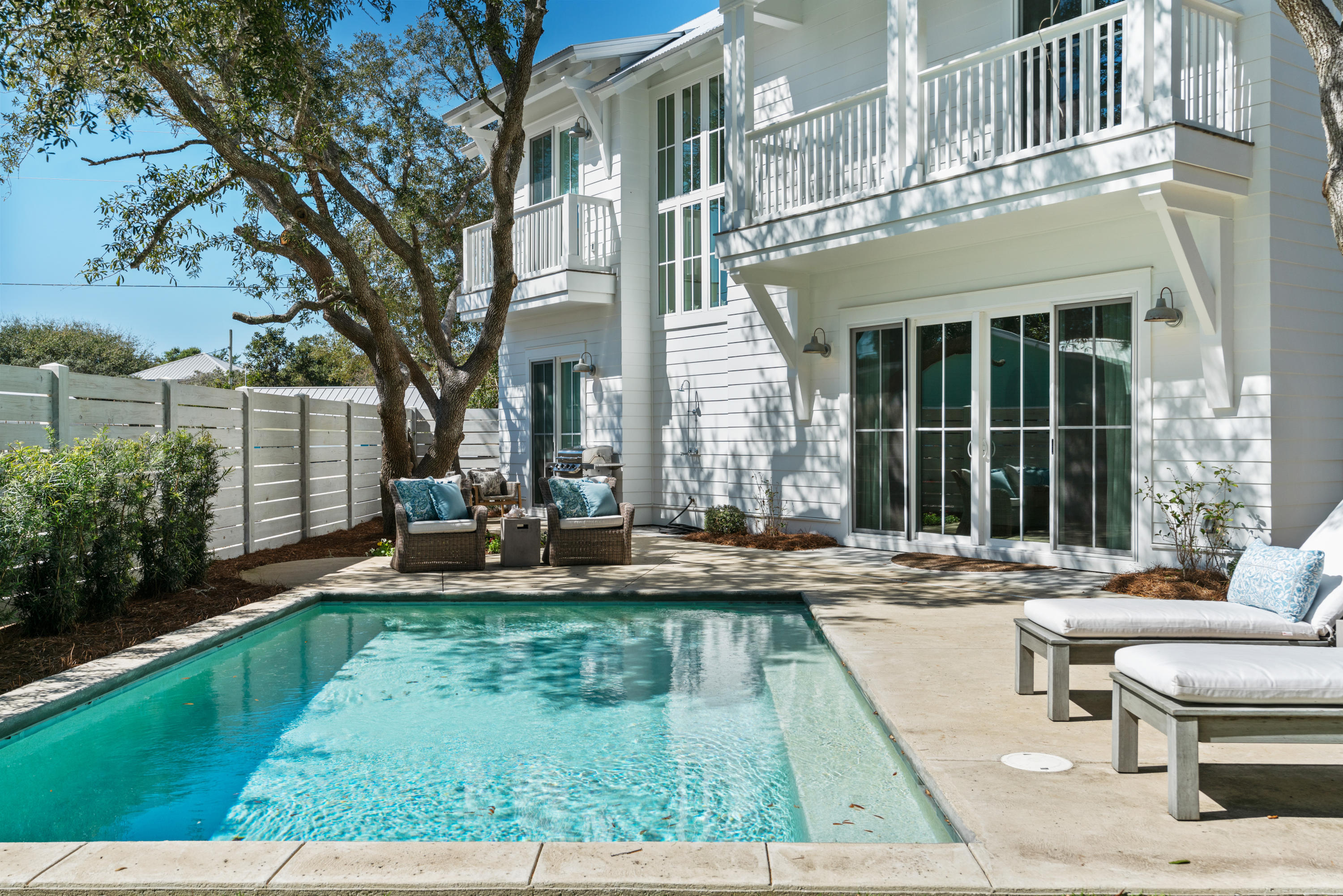 134 Blue Lake Road Santa Rosa Beach, FL 32459 - Photo 21 of 49 a view of a house with backyard sitting area and garden