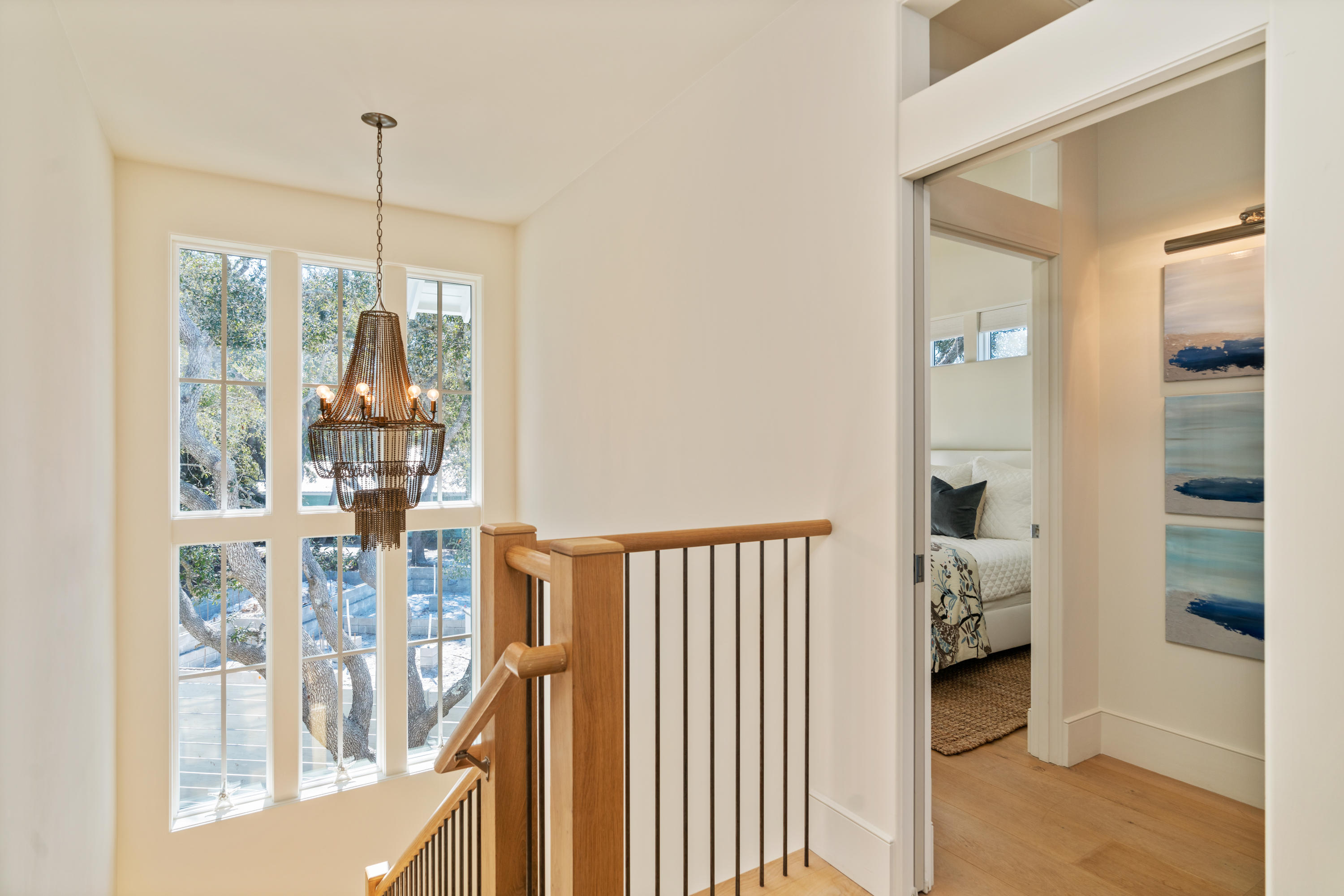 134 Blue Lake Road Santa Rosa Beach, FL 32459 - Photo 28 of 49 a view of a hallway with wooden floor and windows