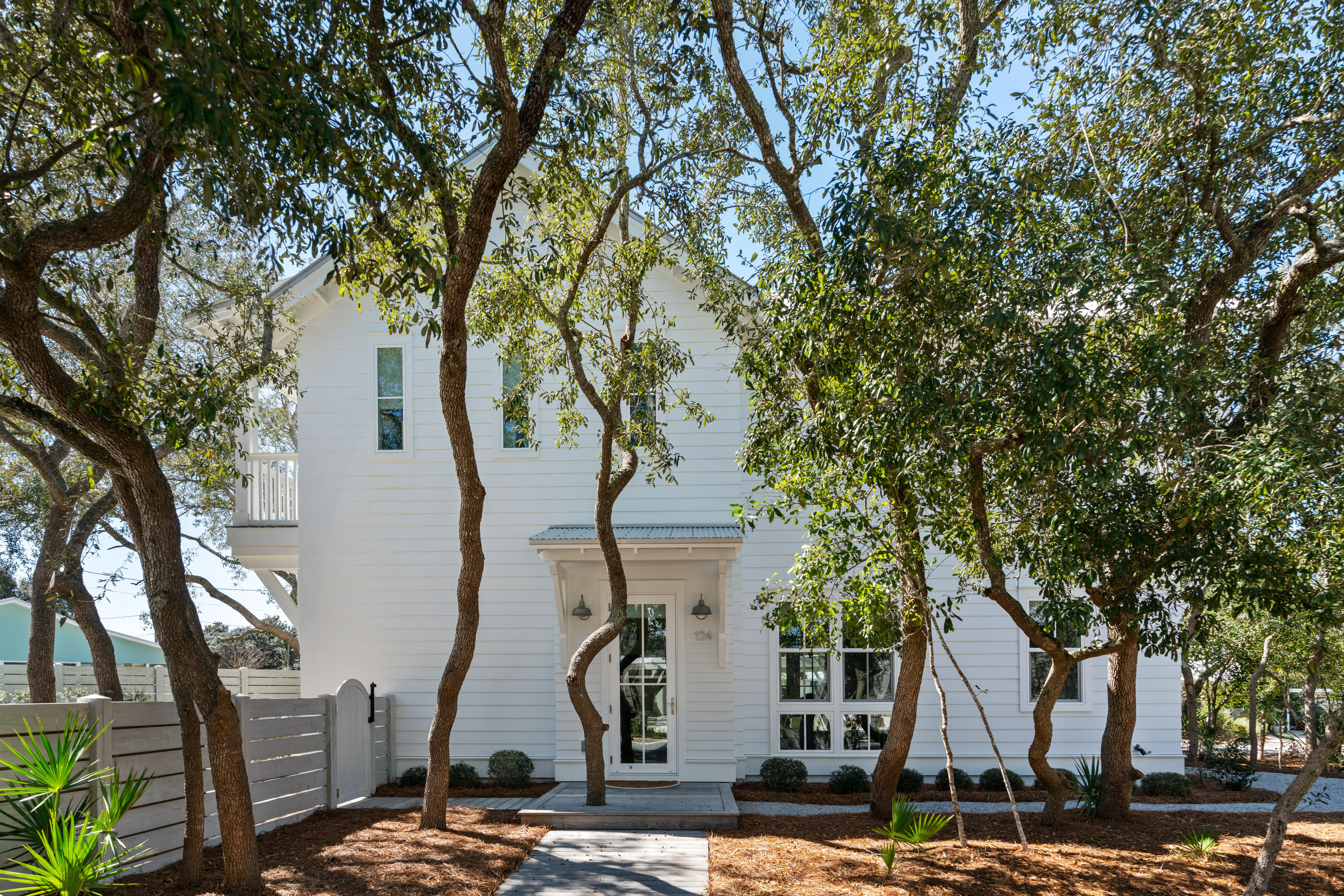 134 Blue Lake Road Santa Rosa Beach, FL 32459 - Photo 3 of 49 a front view of a house with a tree