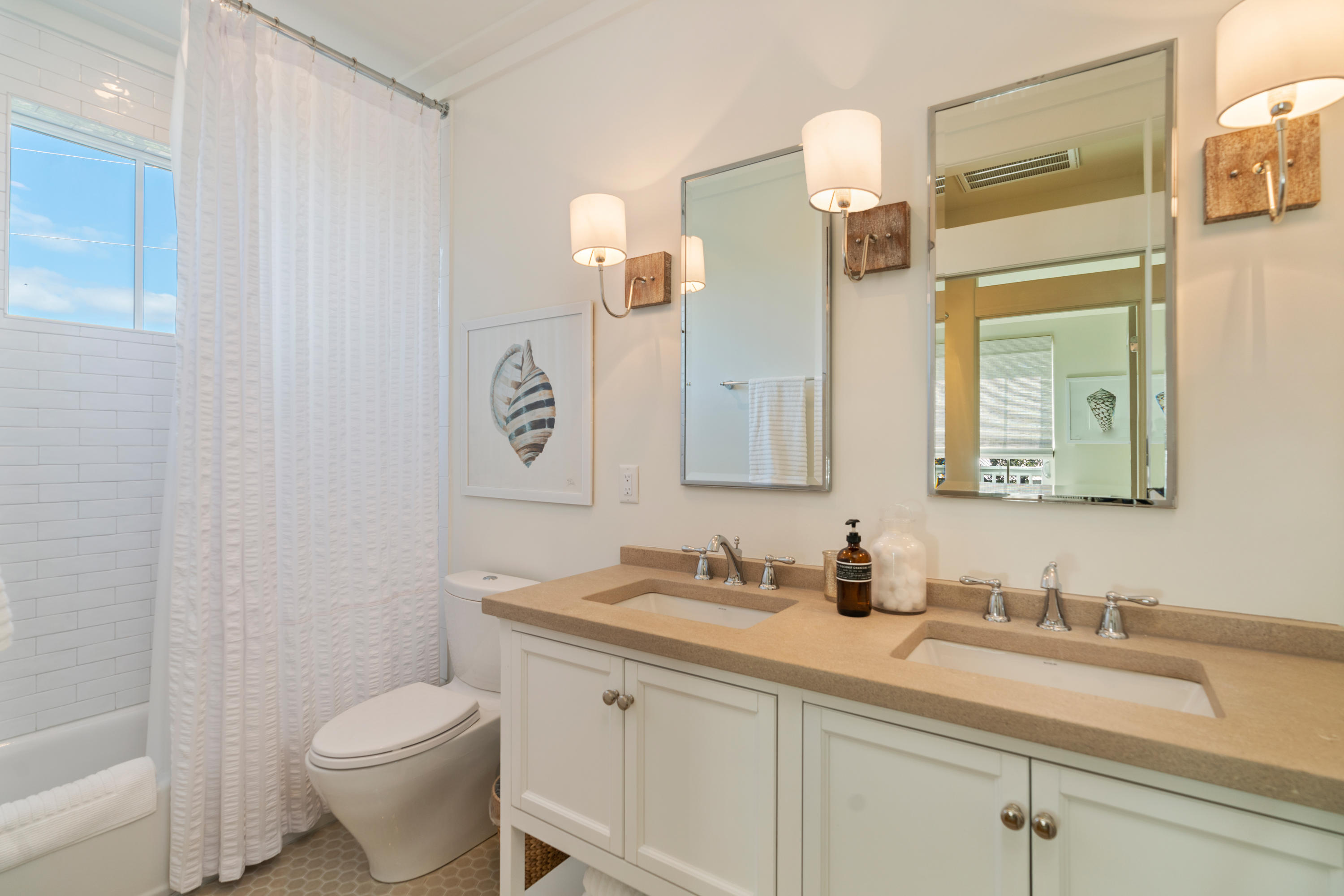 134 Blue Lake Road Santa Rosa Beach, FL 32459 - Photo 33 of 49 a bathroom with a granite countertop sink mirror vanity and toilet