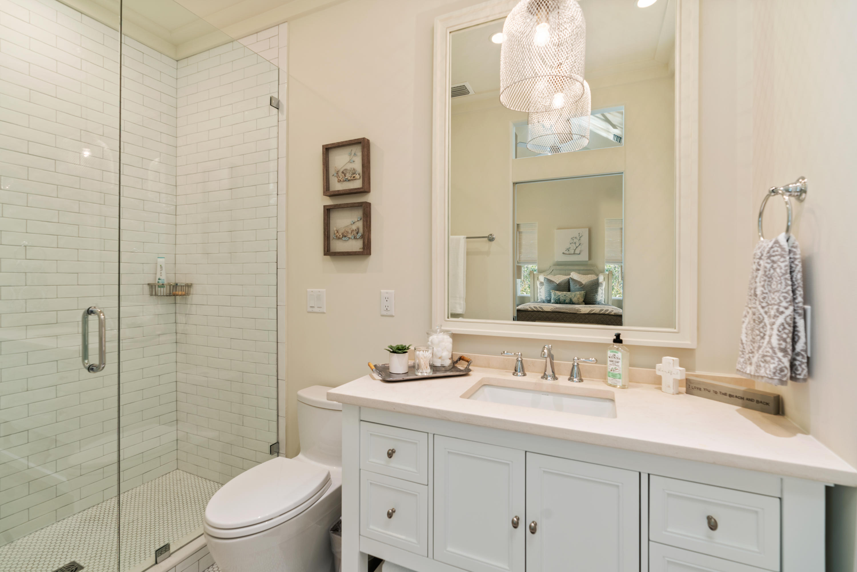 134 Blue Lake Road Santa Rosa Beach, FL 32459 - Photo 36 of 49 a bathroom with a sink a toilet and shower
