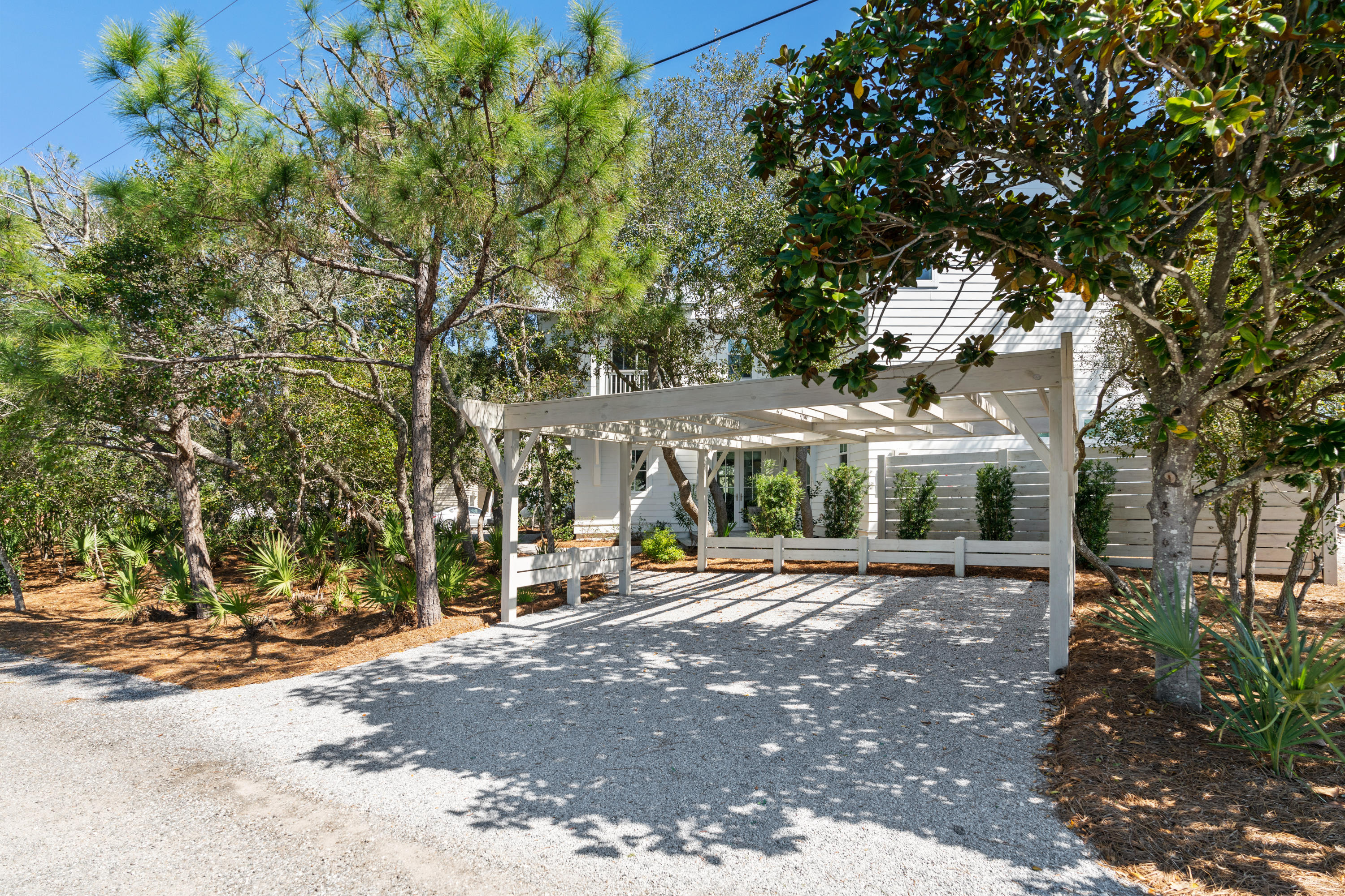 134 Blue Lake Road Santa Rosa Beach, FL 32459 - Photo 4 of 49 a view of a building with a large tree