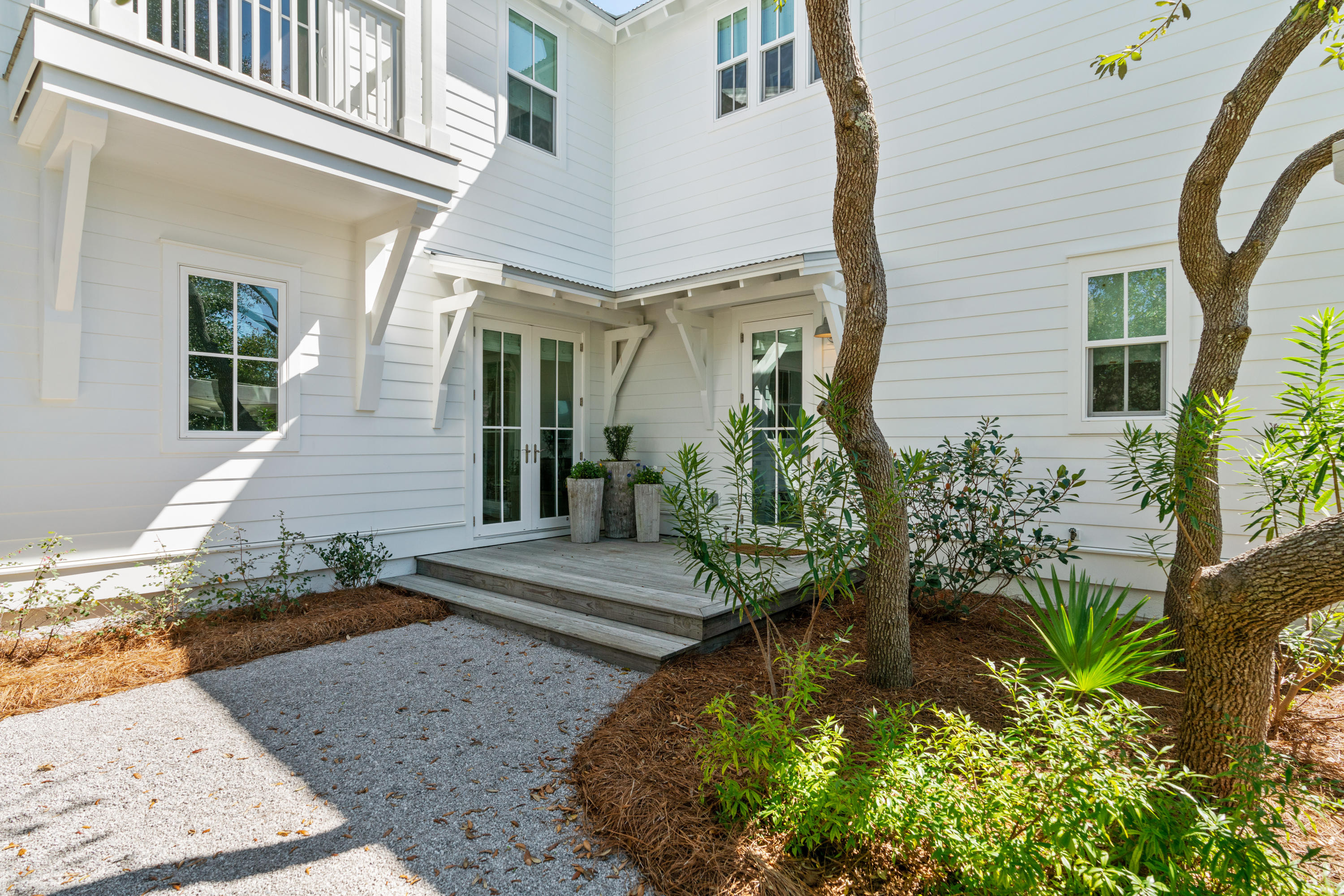 134 Blue Lake Road Santa Rosa Beach, FL 32459 - Photo 5 of 49 a view of a house with potted plants