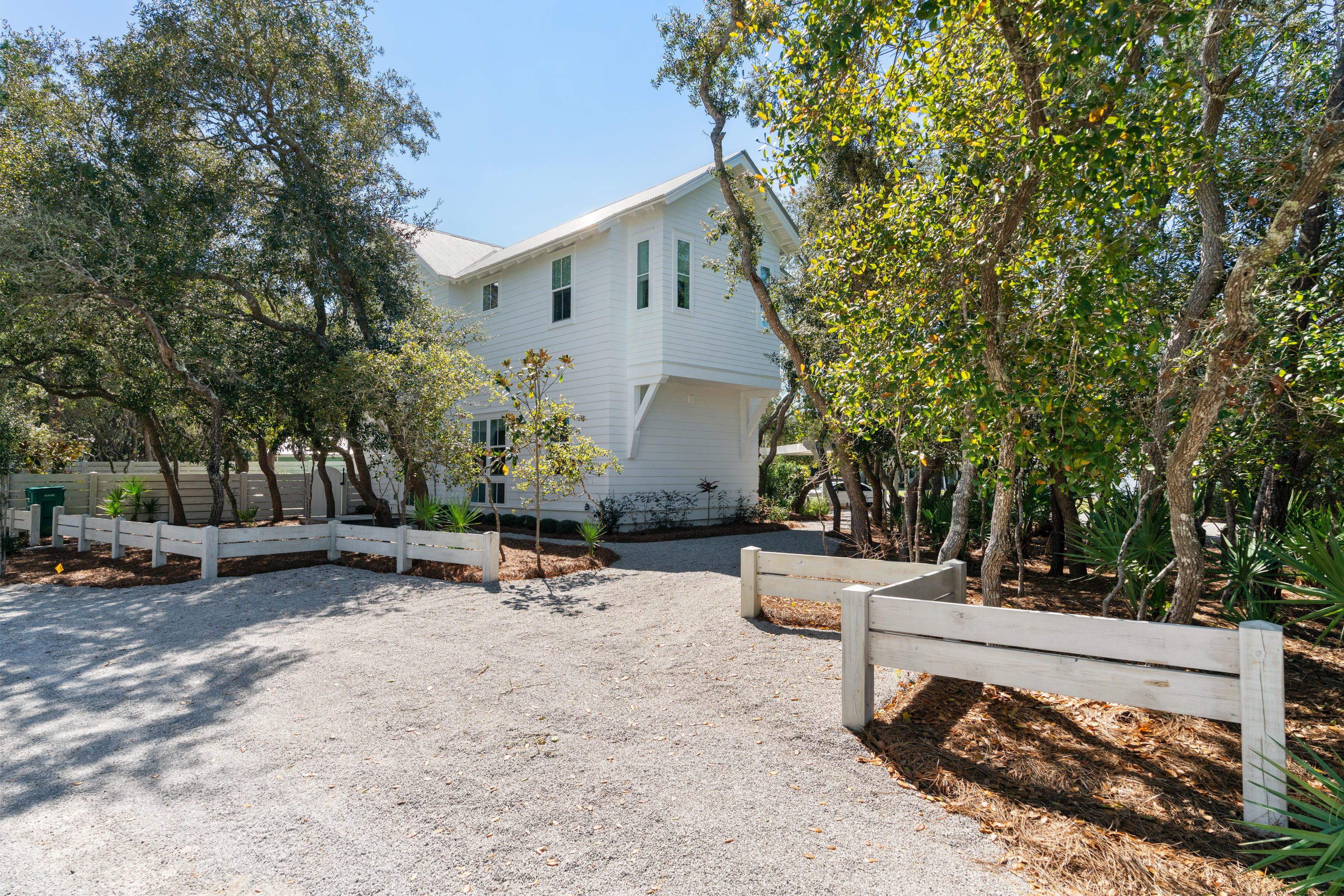 134 Blue Lake Road Santa Rosa Beach, FL 32459 - Photo 6 of 49 a view of a backyard with sitting area and slide