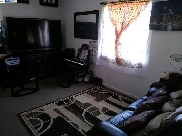 a room with furniture and a flat screen tv