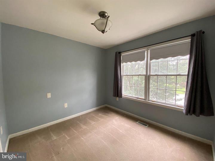 211 Morningside Drive Falling Waters, WV 25419 - Photo 18 of 42 a view of an empty room with a window