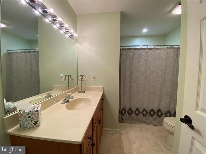 211 Morningside Drive Falling Waters, WV 25419 - Photo 21 of 42 a bathroom with a sink and a mirror