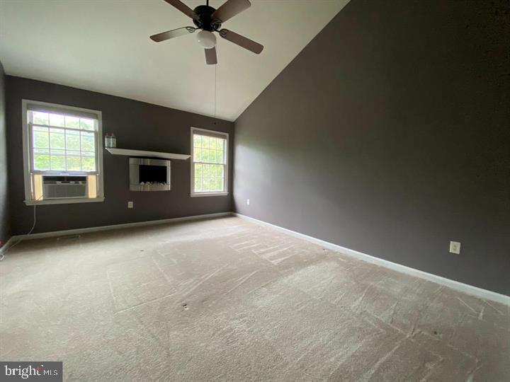 211 Morningside Drive Falling Waters, WV 25419 - Photo 22 of 42 a view of an empty room with a window and fireplace
