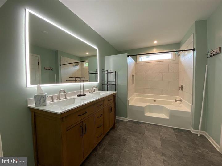 211 Morningside Drive Falling Waters, WV 25419 - Photo 33 of 42 a bathroom with a granite countertop sink mirror and a bath tub