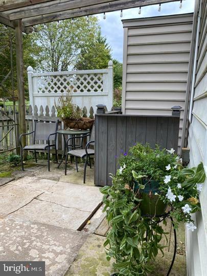 211 Morningside Drive Falling Waters, WV 25419 - Photo 37 of 42 a view of a patio with table and chairs and potted plants