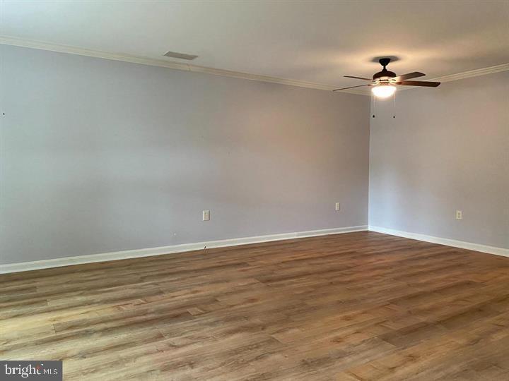 211 Morningside Drive Falling Waters, WV 25419 - Photo 6 of 42 a view of an empty room with wooden floor