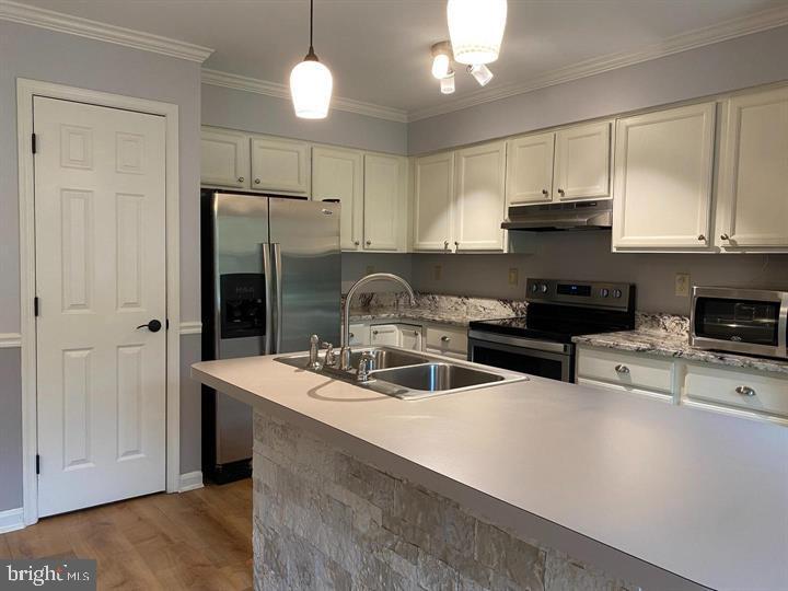 211 Morningside Drive Falling Waters, WV 25419 - Photo 9 of 42 a kitchen with stainless steel appliances granite countertop a sink a stove and a refrigerator