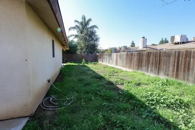 a backyard of a house with lots of green space