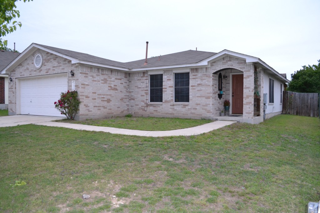 297 Spring Branch Loop Kyle, TX 78640 - Photo 1 of 1 a front view of a house with garden