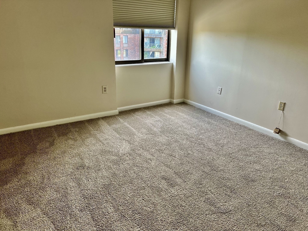 1006 Paradise Road, Unit 3R Swampscott, MA 01907 - Photo 15 of 34 an empty room with windows