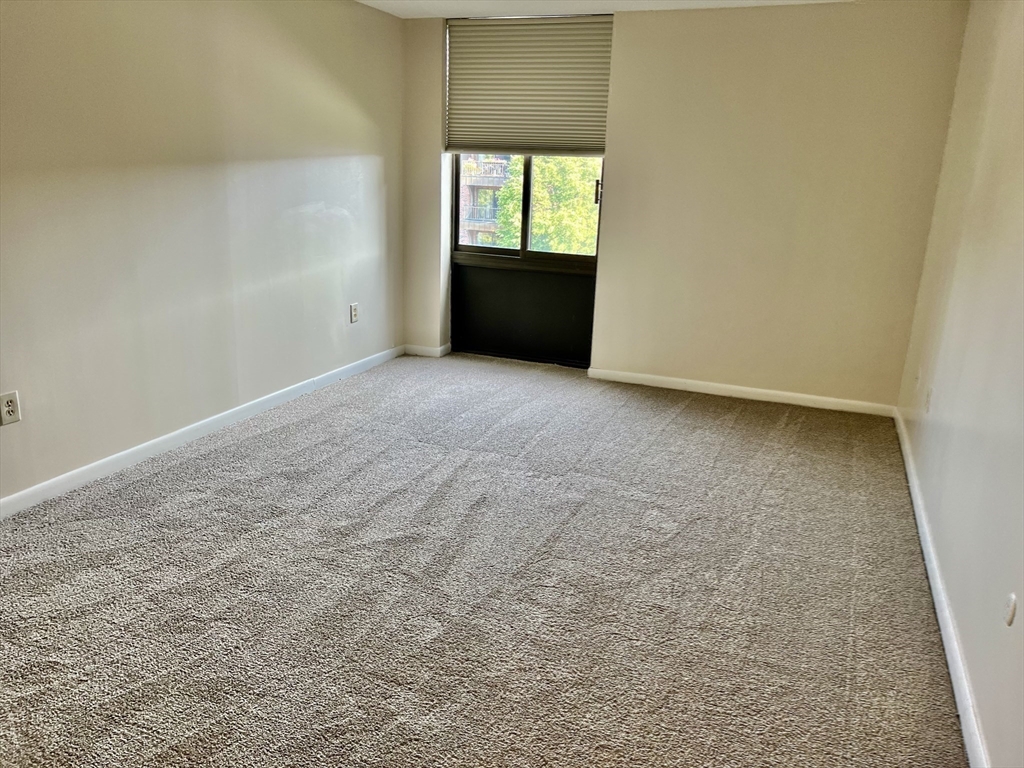 1006 Paradise Road, Unit 3R Swampscott, MA 01907 - Photo 16 of 34 a view of an empty room with a window
