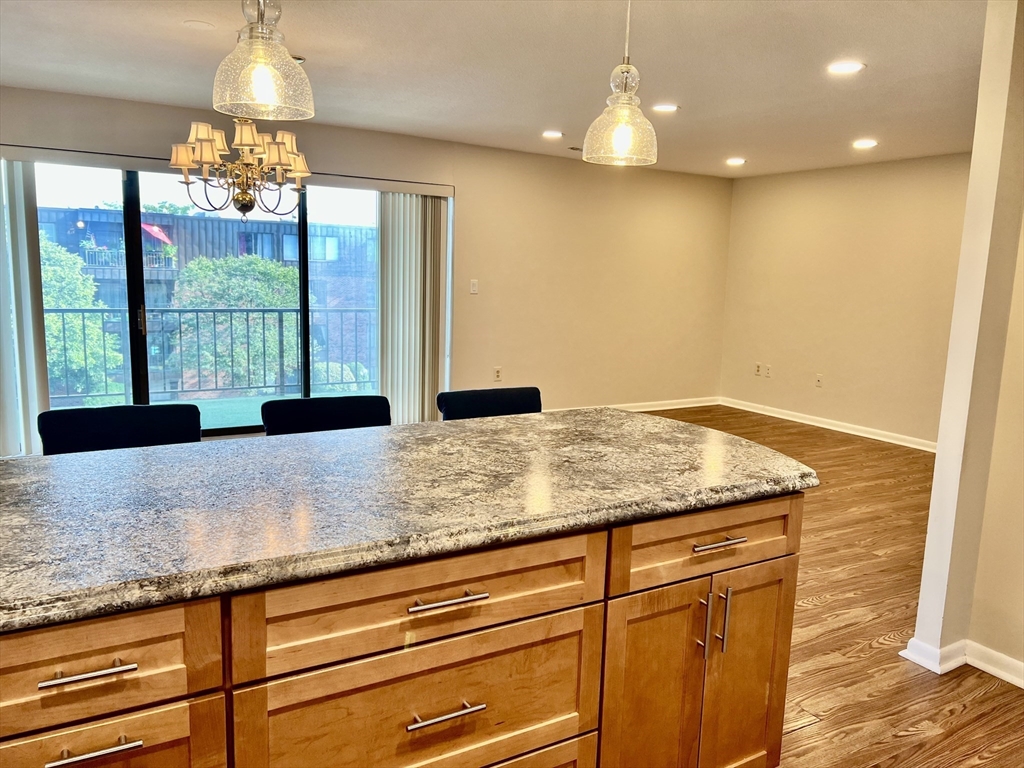 1006 Paradise Road, Unit 3R Swampscott, MA 01907 - Photo 3 of 34 a bathroom with a granite countertop sink and a large window