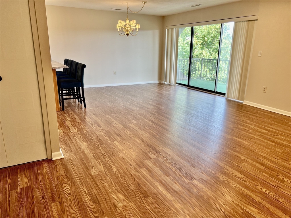 1006 Paradise Road, Unit 3R Swampscott, MA 01907 - Photo 4 of 34 a view of a livingroom with furniture wooden floor and a window