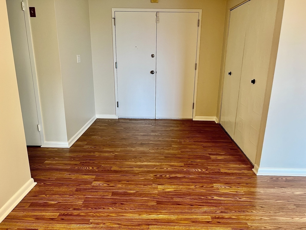 1006 Paradise Road, Unit 3R Swampscott, MA 01907 - Photo 10 of 34 a view of an empty room with wooden floor
